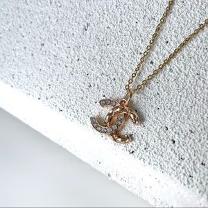 Authentic CHANEL necklace charm.